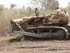 A rented old Caterpillar (earth moving equipment) for land clearing at the Palm Tree plantation site in Awe