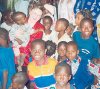 Mama Karen surrounded by kids at Praise Chapel Church in Ogbomoso